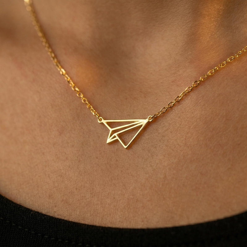 Gold folded paper airplane charm necklace on a fine cable chain (2 of 11)