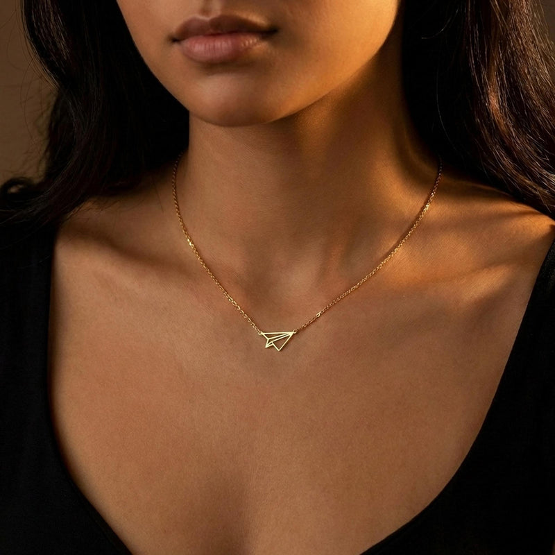 Gold folded paper airplane charm necklace on a fine cable chain (3 of 11)