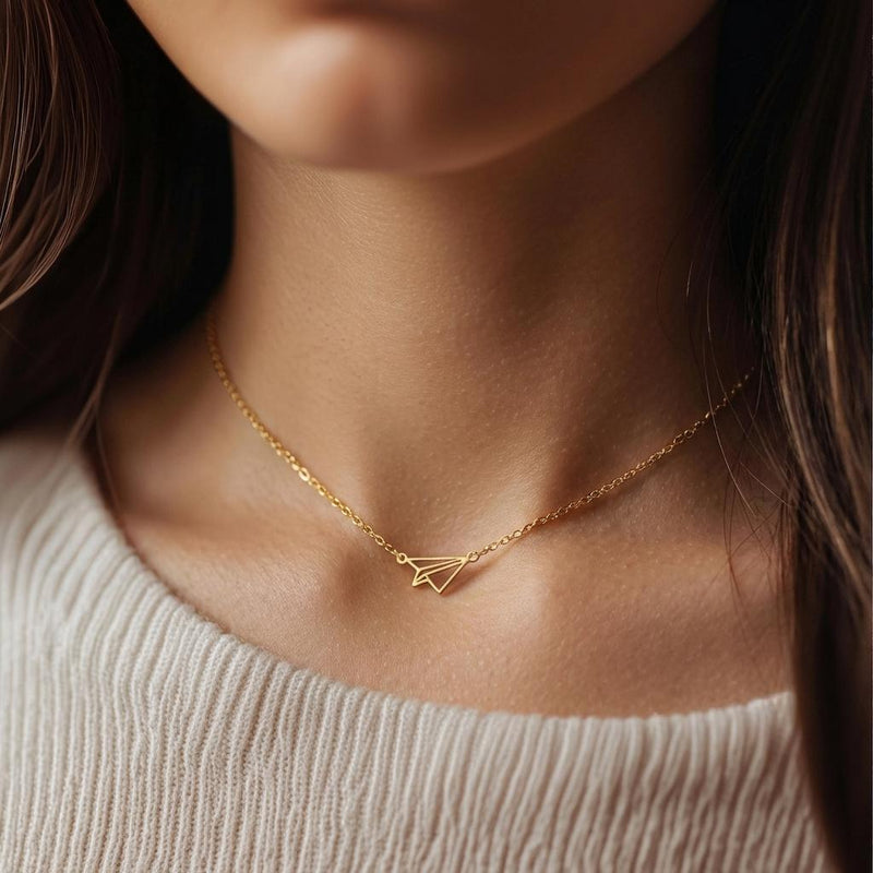 Gold folded paper airplane charm necklace on a fine cable chain (4 of 11)