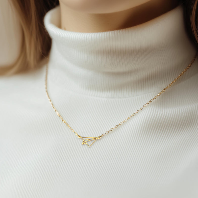 Gold folded paper airplane charm necklace on a fine cable chain (5 of 11)