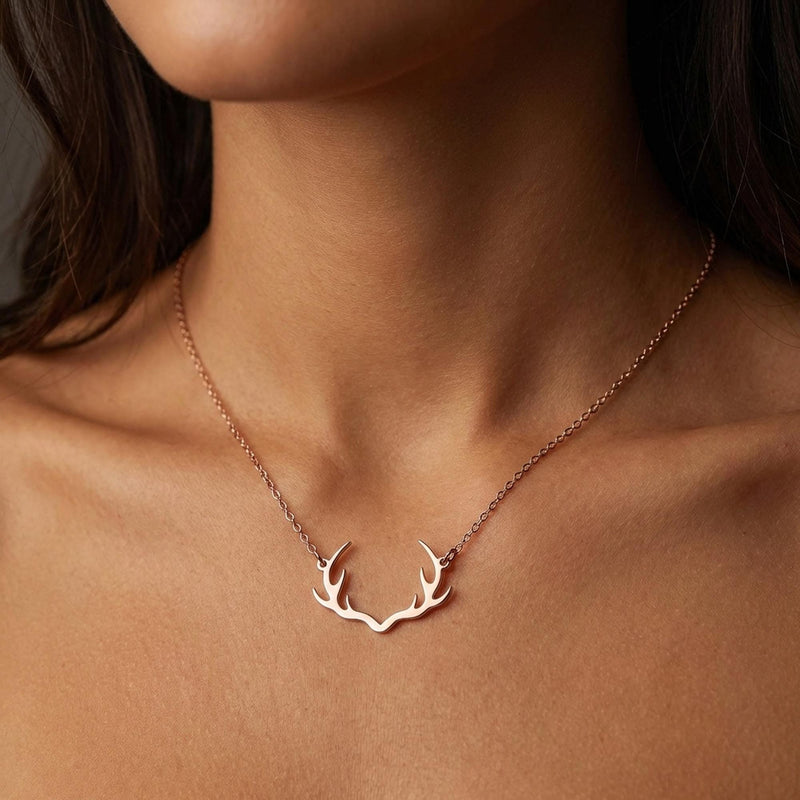 Gold deer antler pendant with visible tines on a thin cable chain (6 of 11)