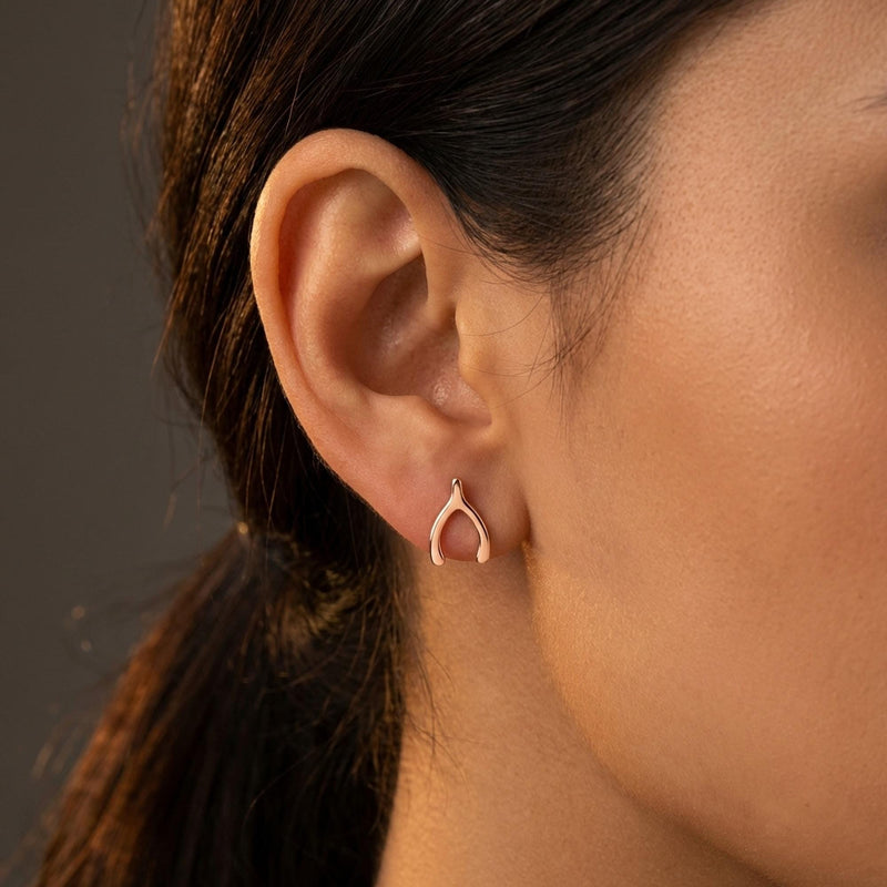 Pair of small gold wishbone stud earrings with two thin arms (5 of 8)