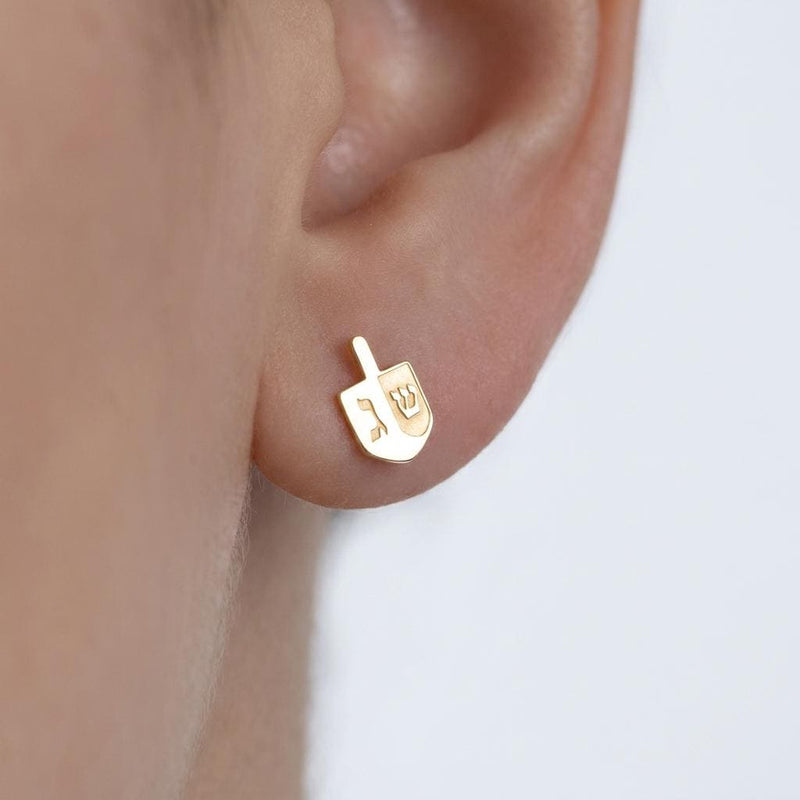 Pair of small gold dreidel stud earrings with a short handle and flat faces. (2 of 8)