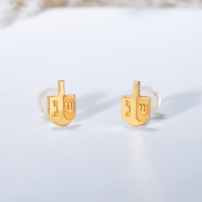 Pair of small gold dreidel stud earrings with a short handle and flat faces. (3 of 8)
