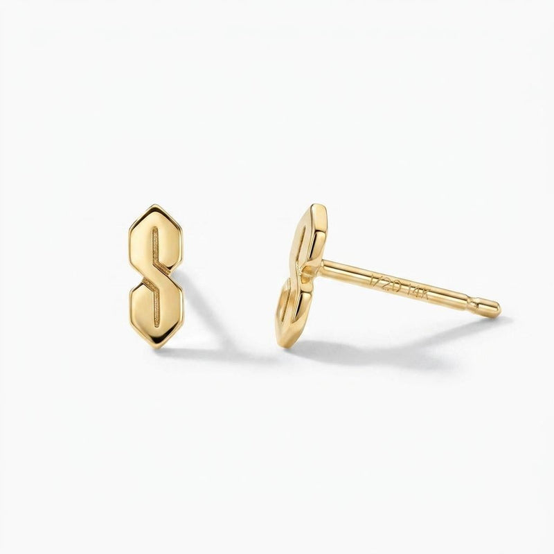 Narrow gold S shaped stud earrings, geometric ninetes doodle motif, shown as a pair