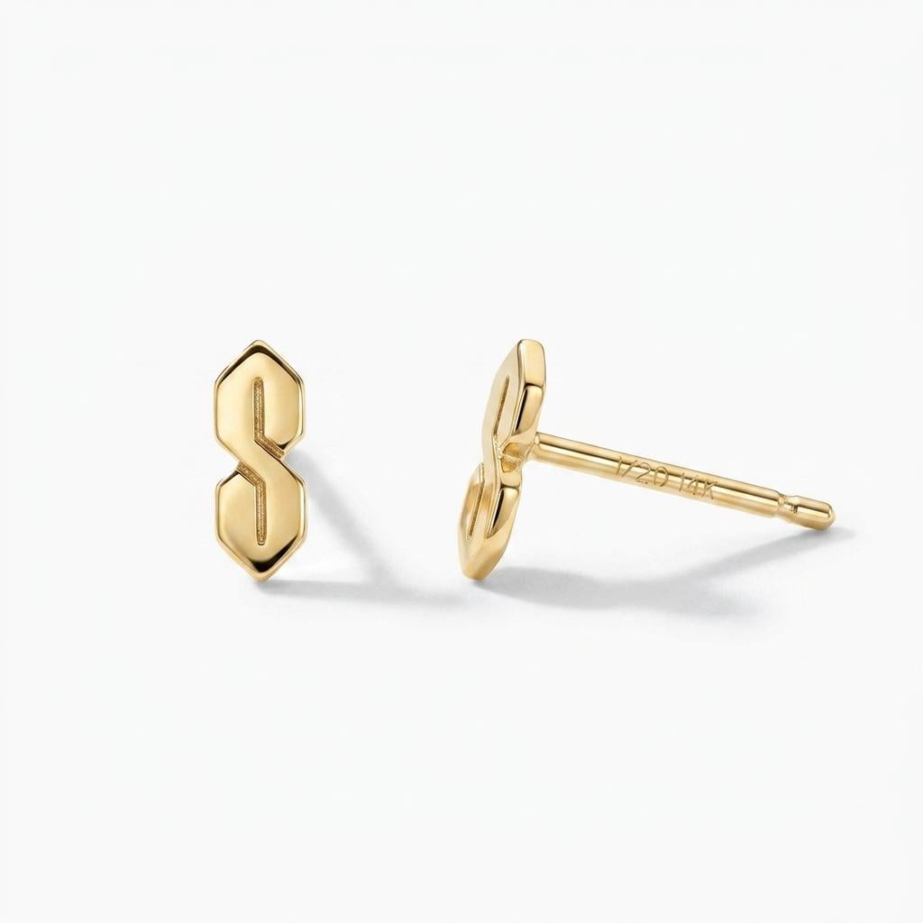 Narrow gold S shaped stud earrings, geometric ninetes doodle motif, shown as a pair