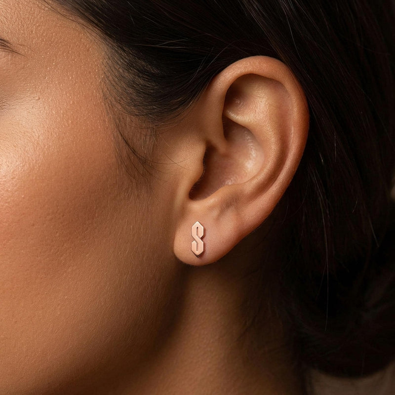 Narrow gold S shaped stud earrings, geometric ninetes doodle motif, shown as a pair (5 of 9)