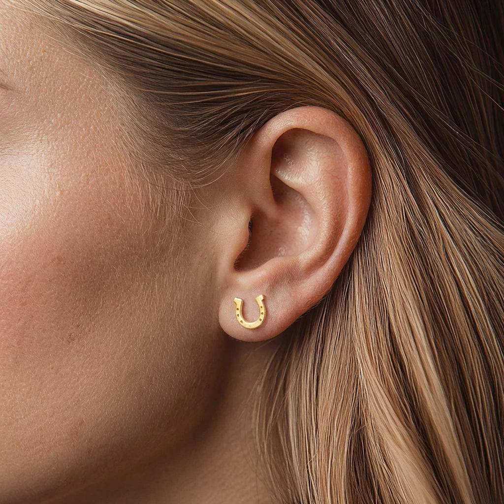 Small gold horseshoe stud earrings with nail holes along the curve (2 of 11)