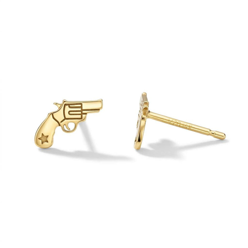 Pair of tiny gold revolver stud earrings with the barrel pointing forward