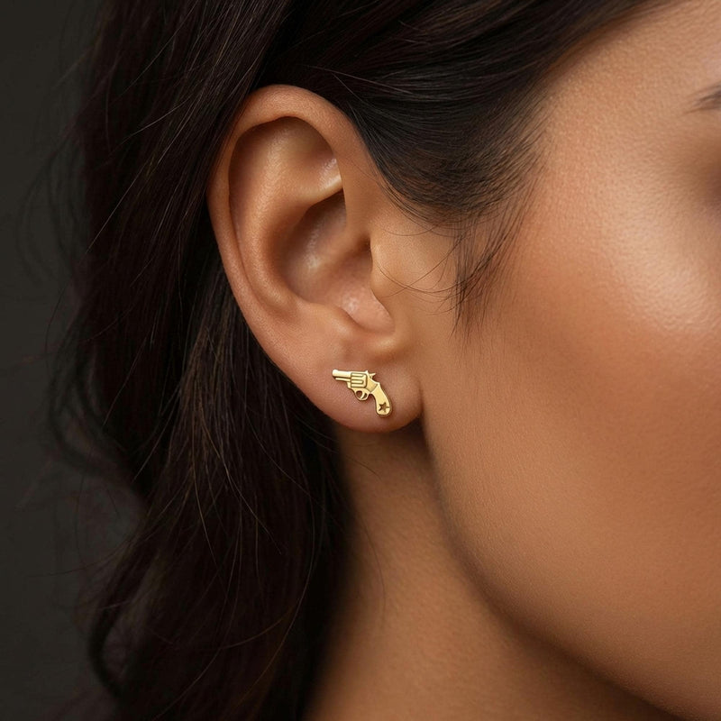 Pair of tiny gold revolver stud earrings with the barrel pointing forward (2 of 8)