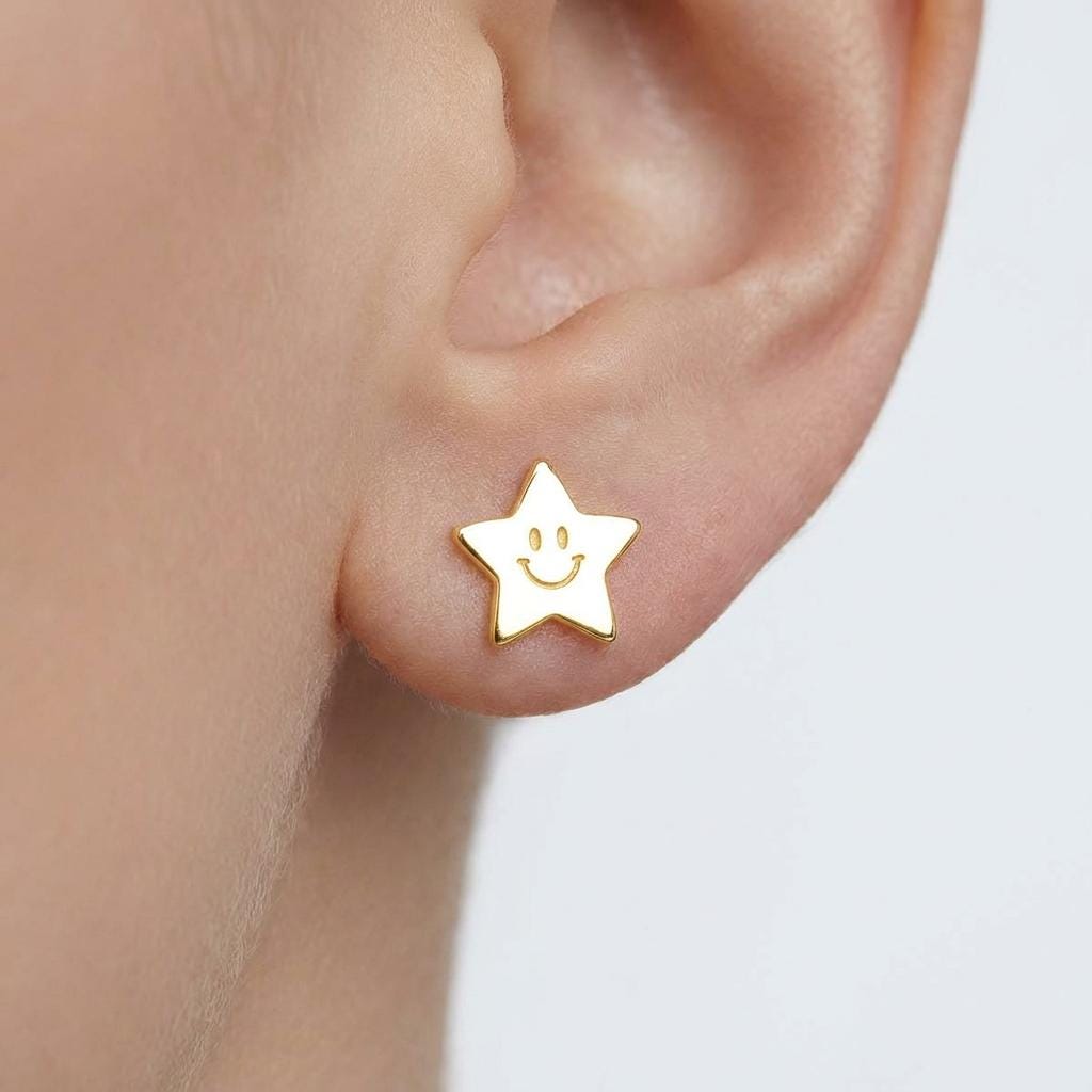 Pair of gold star stud earrings with a smiling face on each star (2 of 5)