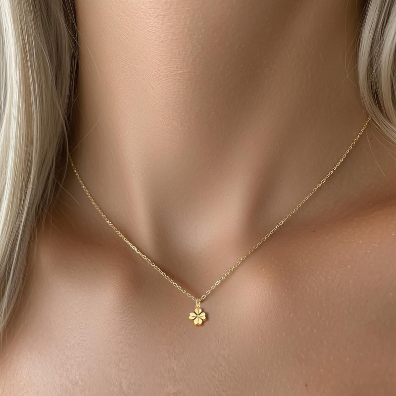 Fine gold chain necklace with a very small four leaf clover pendant (3 of 6)