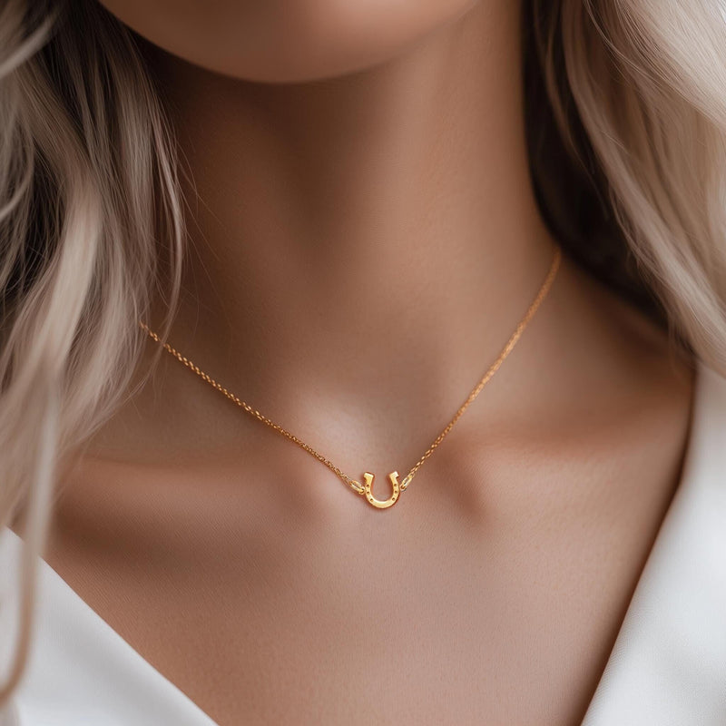 Tiny gold horseshoe pendant with nail holes on a fine chain (3 of 11)