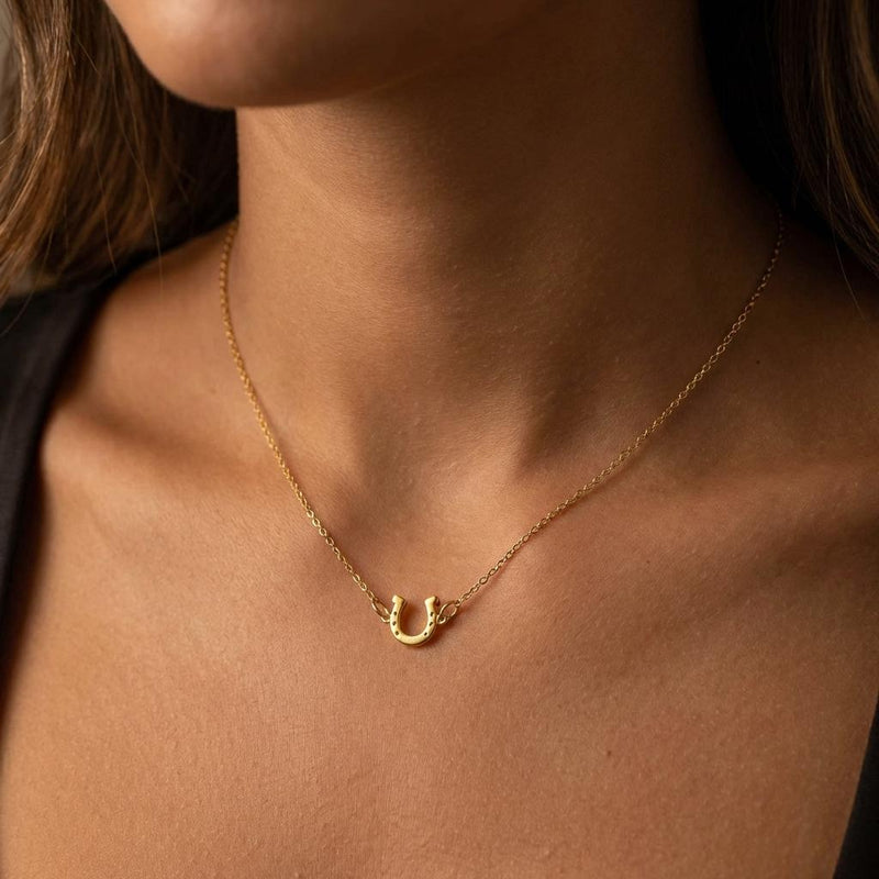 Tiny gold horseshoe pendant with nail holes on a fine chain (4 of 11)