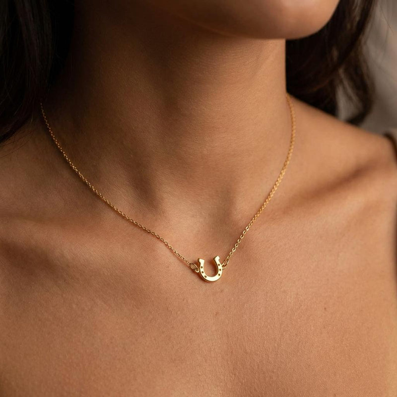 Tiny gold horseshoe pendant with nail holes on a fine chain (5 of 11)
