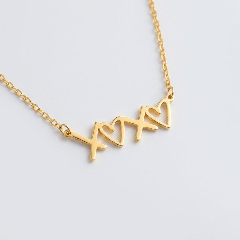Small script XOXO pendant in gold on a fine cable chain (12 of 12)