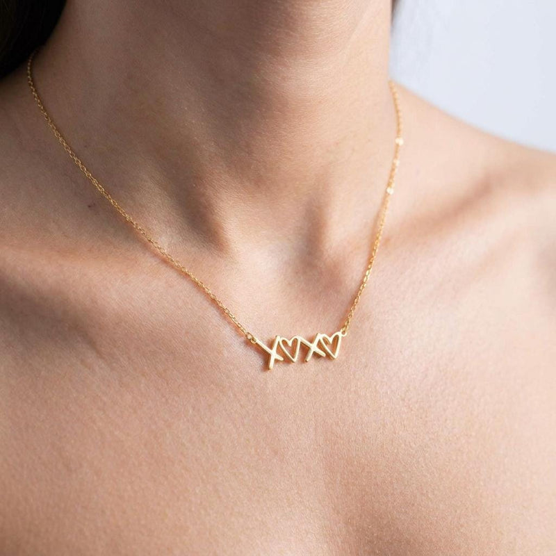 Small script XOXO pendant in gold on a fine cable chain (2 of 12)