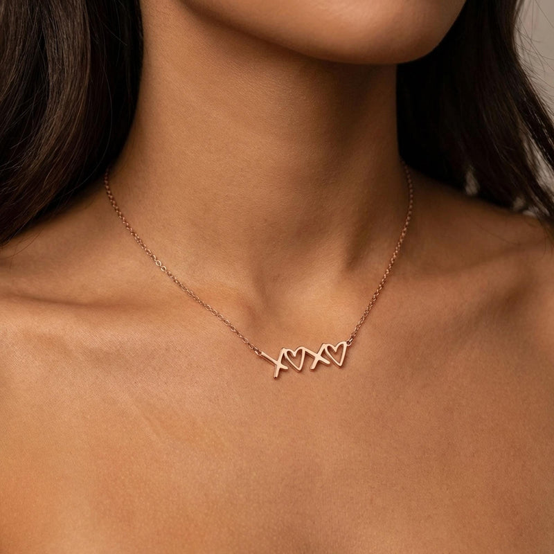 Small script XOXO pendant in gold on a fine cable chain (3 of 12)