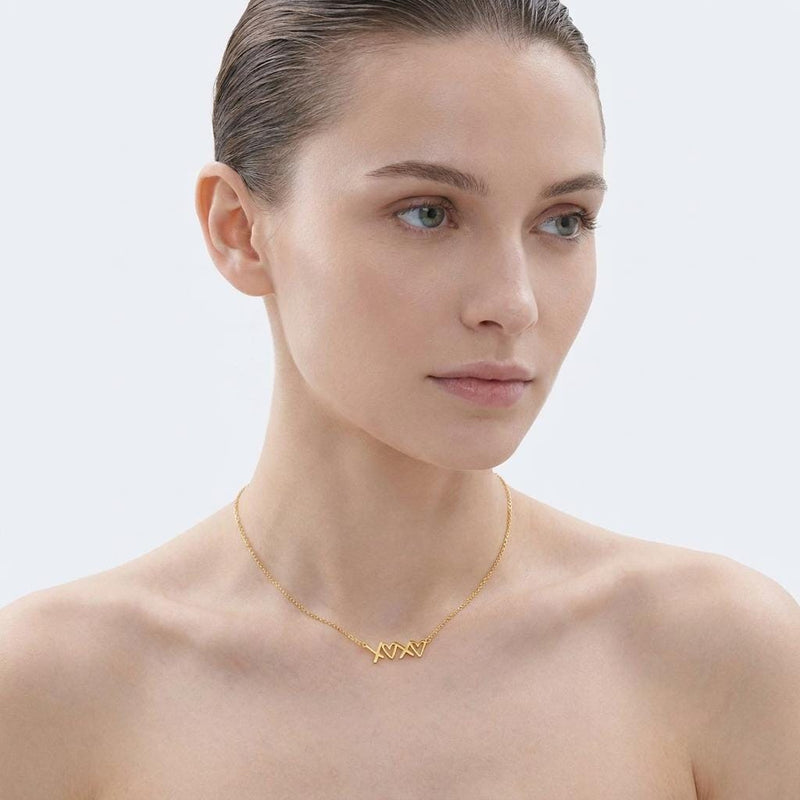Small script XOXO pendant in gold on a fine cable chain (4 of 12)