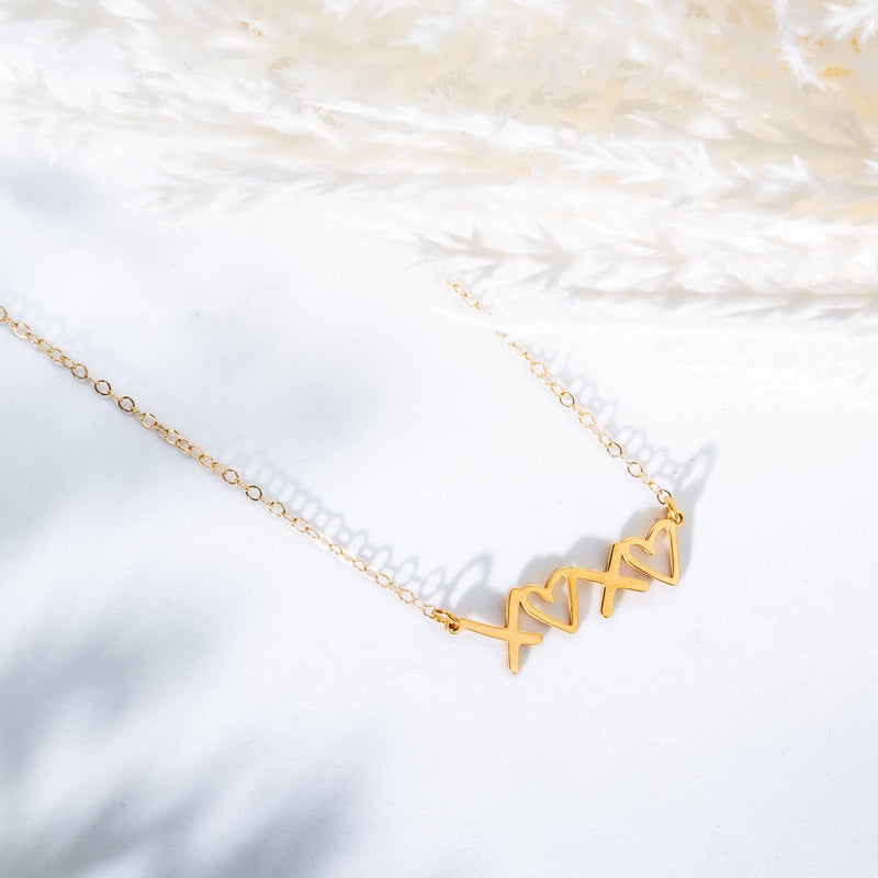 Small script XOXO pendant in gold on a fine cable chain (5 of 12)