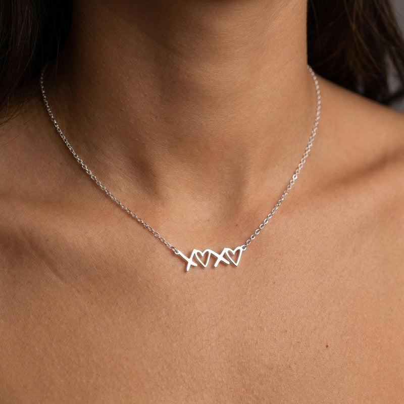 Small script XOXO pendant in gold on a fine cable chain (6 of 12)