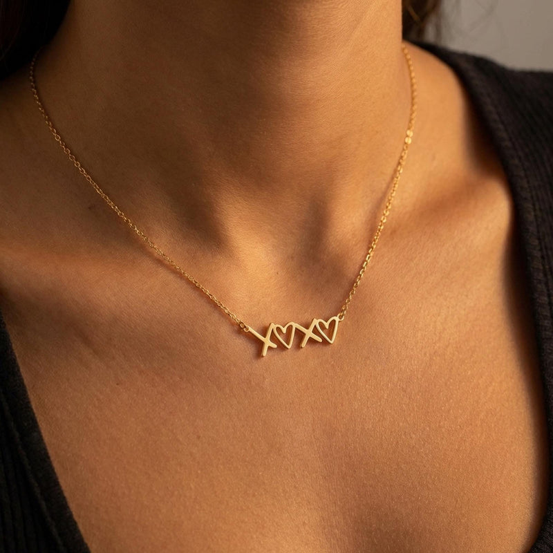 Small script XOXO pendant in gold on a fine cable chain (7 of 12)