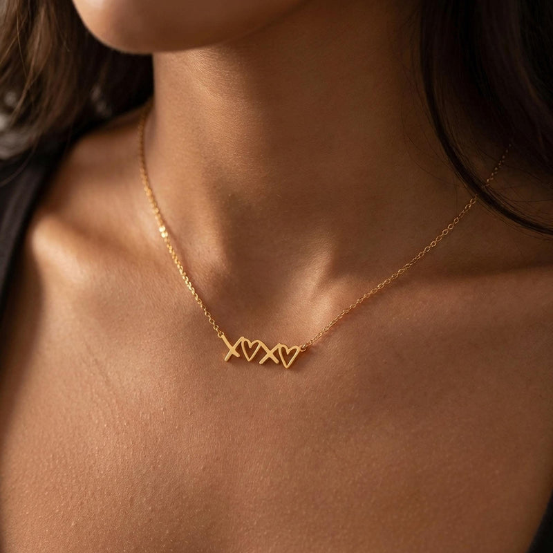 Small script XOXO pendant in gold on a fine cable chain (8 of 12)