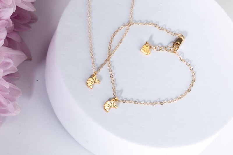 Fine gold chain bracelet with a tiny croissant charm (3 of 7)