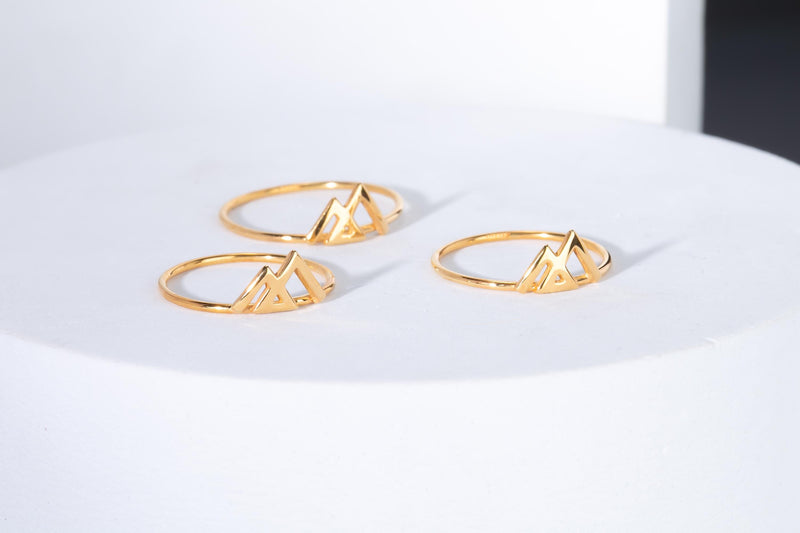 Slim gold ring topped with an angular geometric mountain range design (4 of 7)