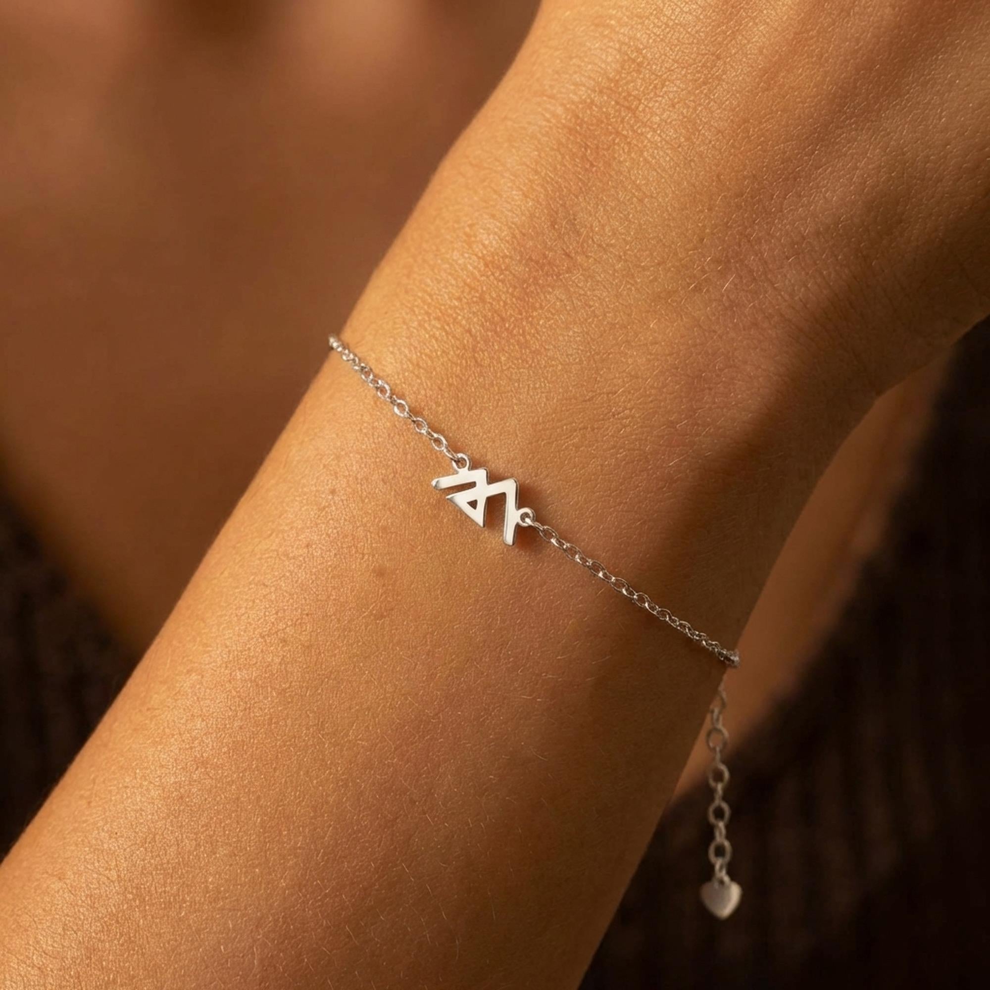 Geometric mountain peak charm on a fine gold chain bracelet (2 of 9)