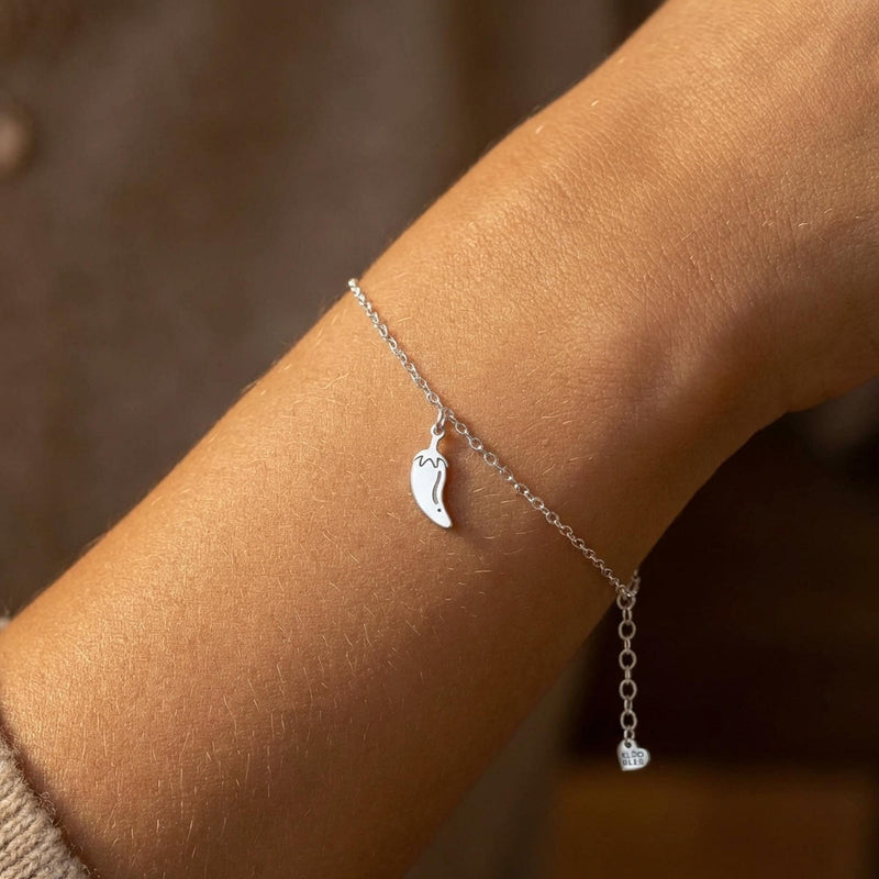 Tiny gold chili pepper charm with curved body and hooked stem on a chain bracelet (3 of 12)
