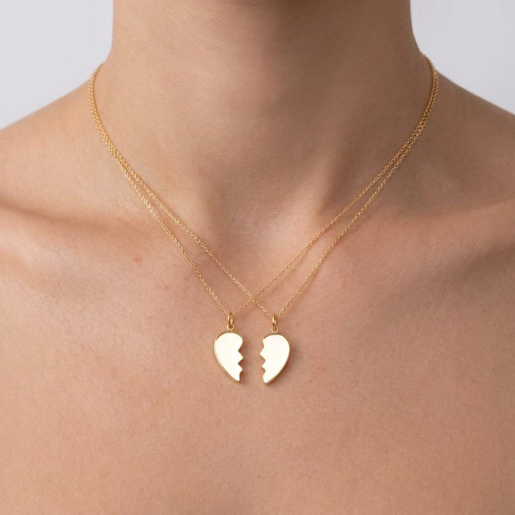 Small gold half heart pendant with a jagged edge on a fine chain (2 of 8)
