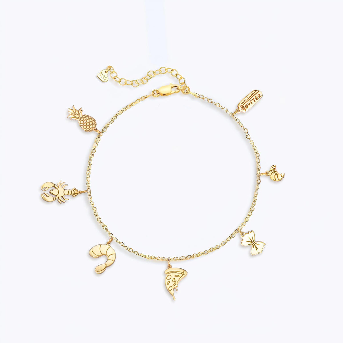 Fine gold chain anklet hung with several tiny gold charms