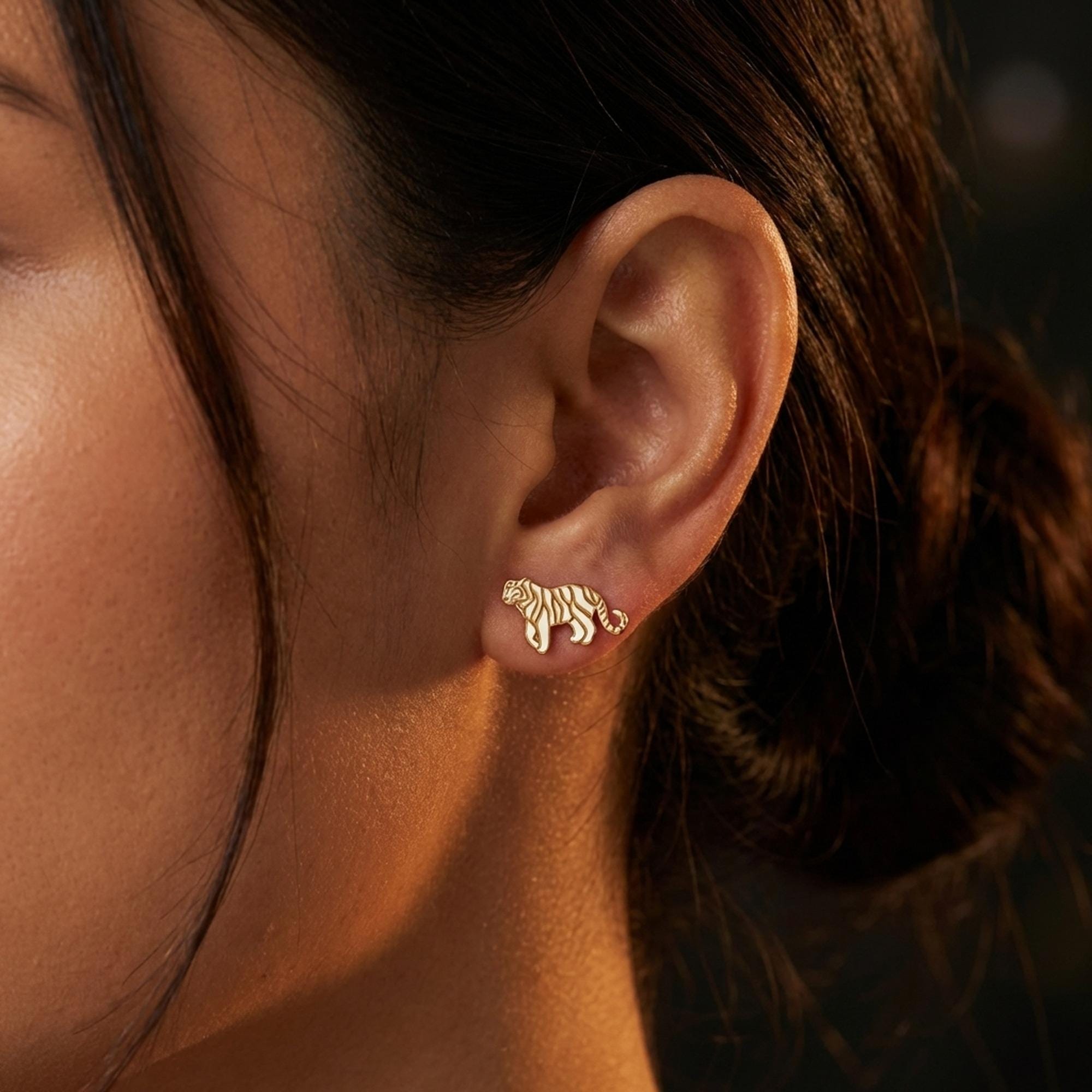 Small gold tiger stud earrings with cut stripe detail, shown as a pair (2 of 12)