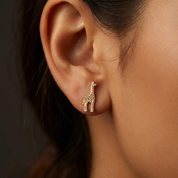 Tall slim gold giraffe stud earrings shown standing in full body