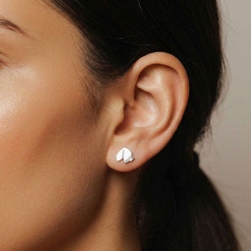 Pair of tiny gold fortune cookie stud earrings with a paper slip detail, on white (3 of 8)