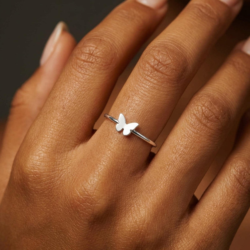 Slim gold band ring with a small flat butterfly on the crown (3 of 11)