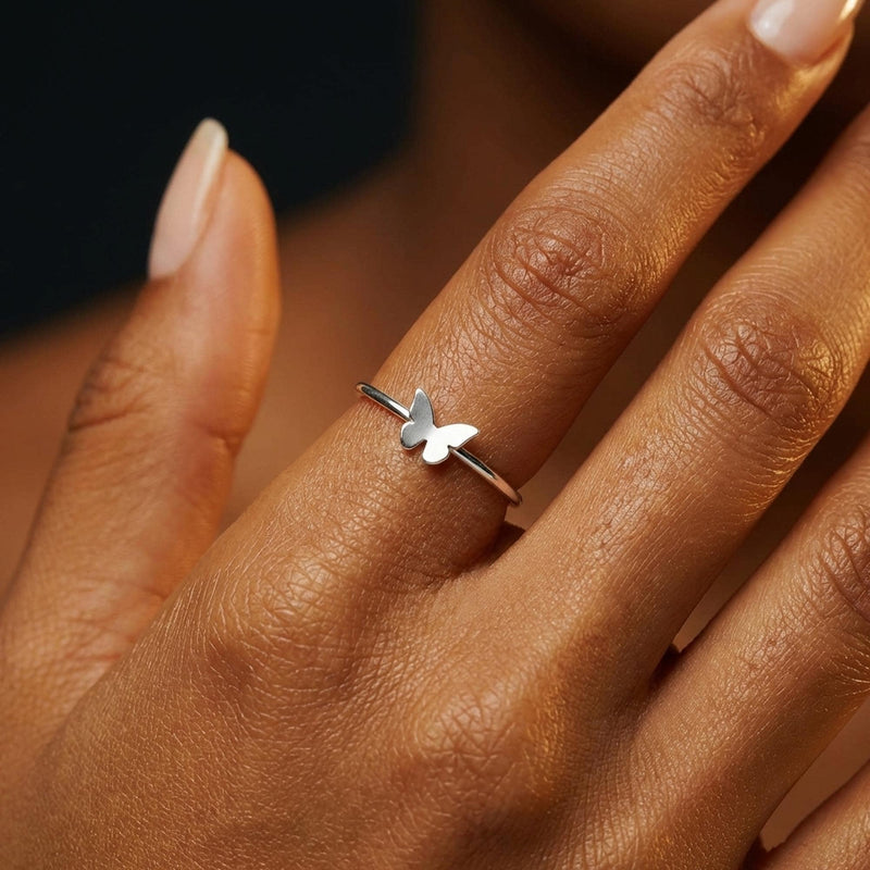 Slim gold band ring with a small flat butterfly on the crown (4 of 11)