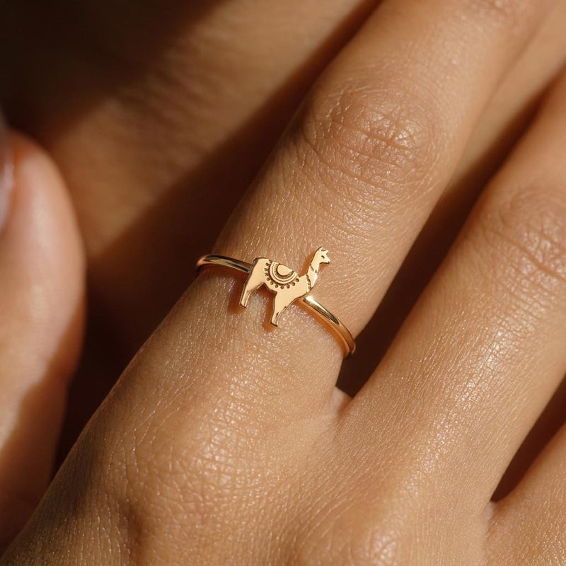 Thin gold stacking ring topped with a small standing llama charm (10 of 13)