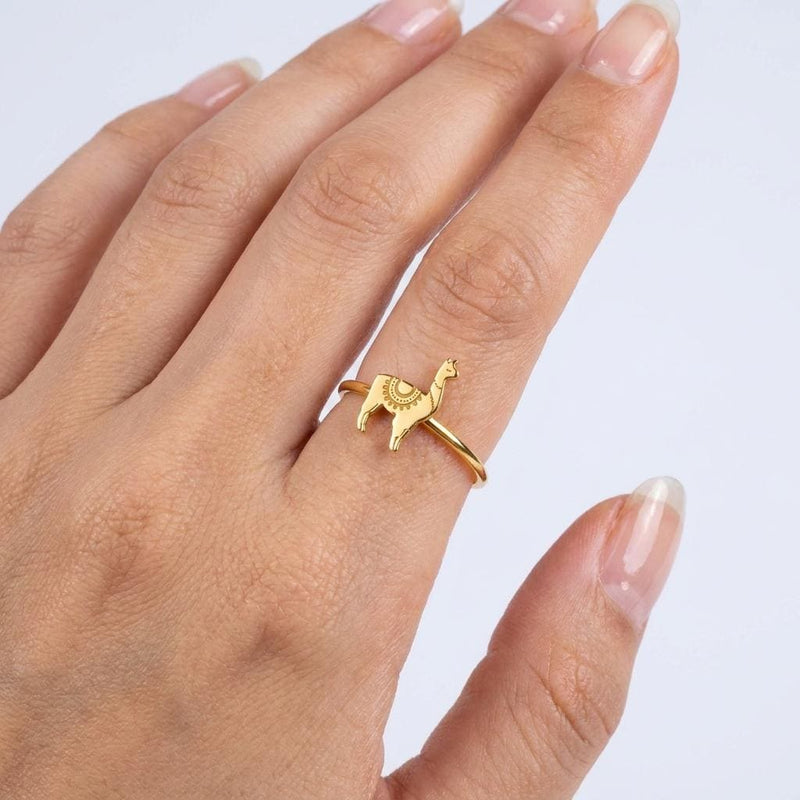 Thin gold stacking ring topped with a small standing llama charm (2 of 13)