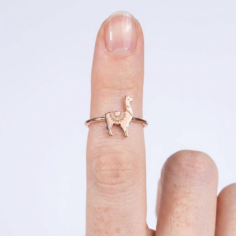 Thin gold stacking ring topped with a small standing llama charm (3 of 13)