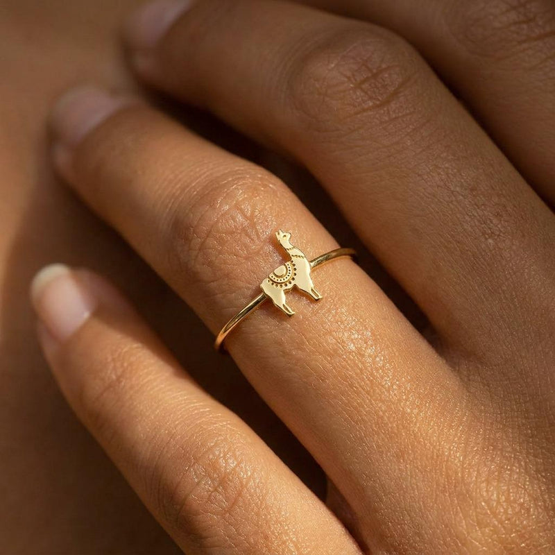 Thin gold stacking ring topped with a small standing llama charm (5 of 13)