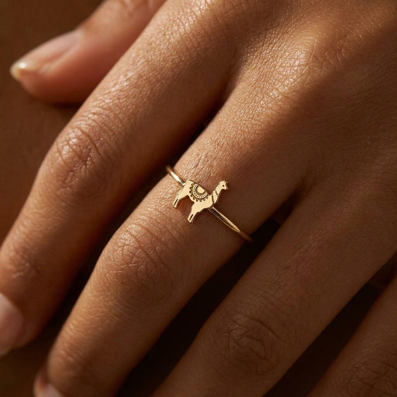 Thin gold stacking ring topped with a small standing llama charm (6 of 13)