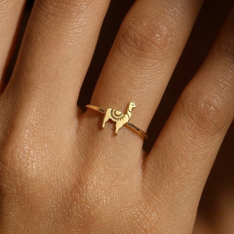 Thin gold stacking ring topped with a small standing llama charm (7 of 13)