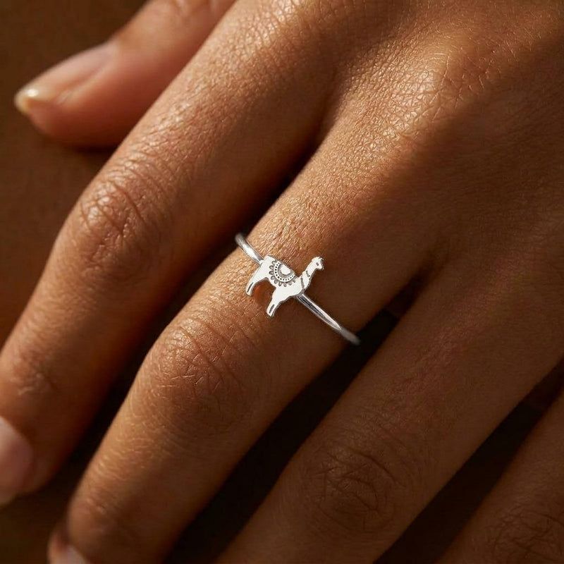 Thin gold stacking ring topped with a small standing llama charm (8 of 13)