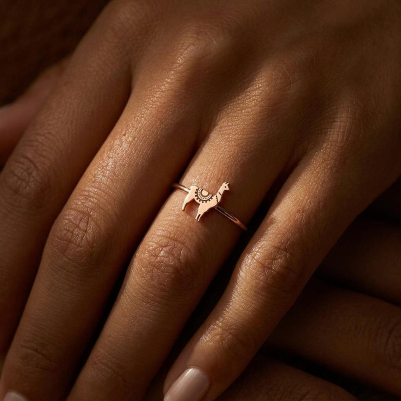 Thin gold stacking ring topped with a small standing llama charm (9 of 13)