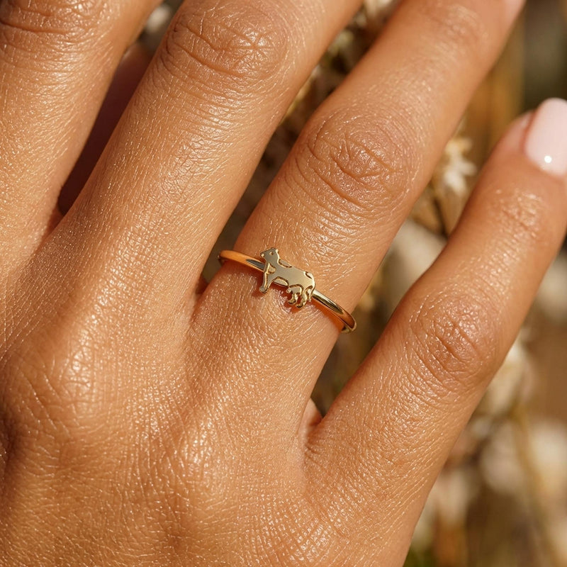 Slim gold stacking ring with a small flat cow design on the top (9 of 9)