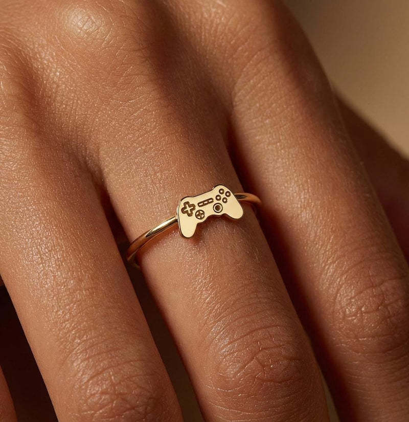 Thin gold ring with a small video game controller shape on the band (2 of 7)