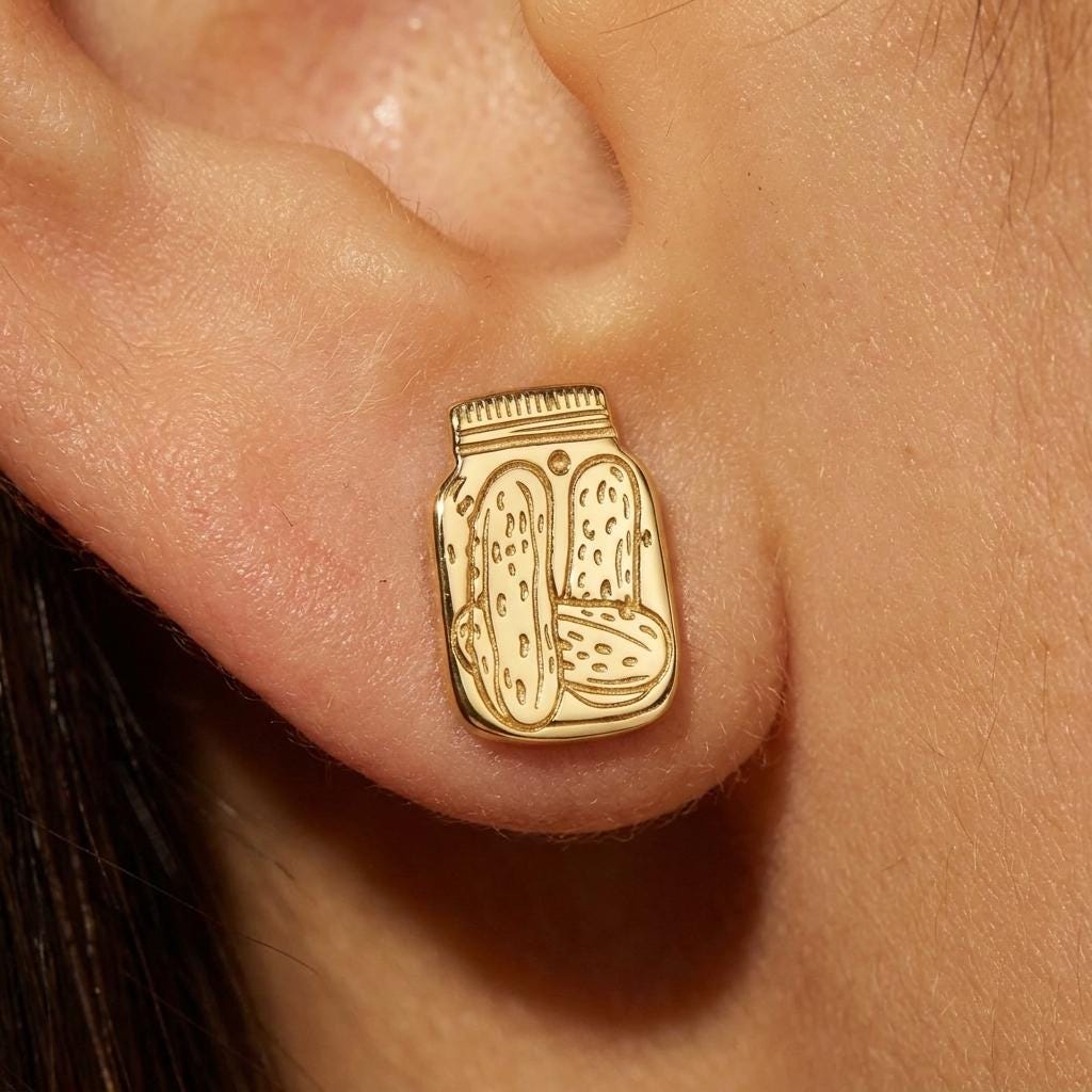 Pair of tiny pickle jar stud earrings in gold with a lid and spears inside