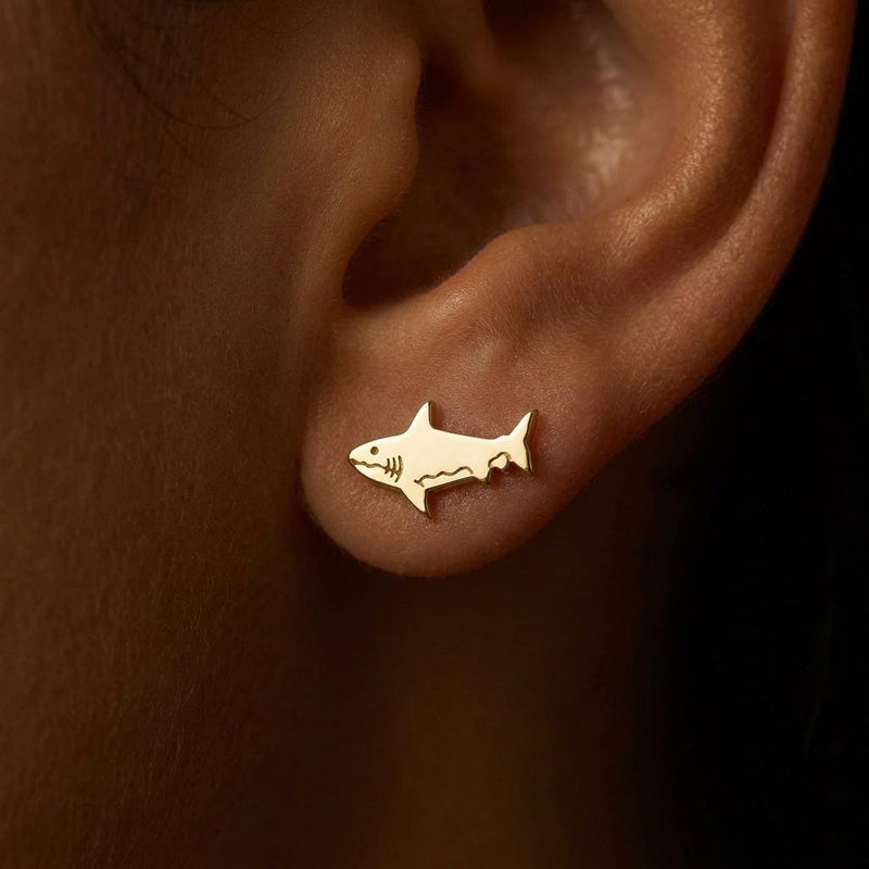 Pair of small shark stud earrings in gold with dorsal fin and curved tail (4 of 14)
